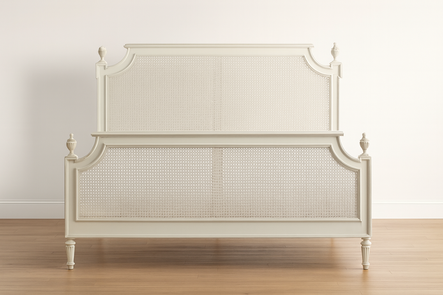 White bed with caned headboard on a wooden floor