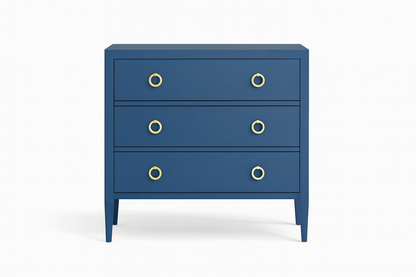 Blue dresser with gold knobs on a white background
